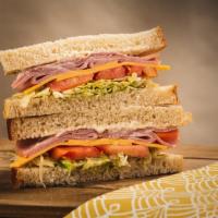 The Ham · sliced ham topped with swiss cheese, shredded lettuce, tomatoes and mayo.
