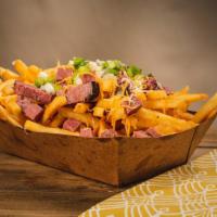 Pastrami Fries · thinly sliced pastrami, topped with melted cheese diced pickles and brown mustard.
