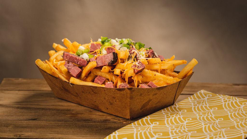 Pastrami Fries · thinly sliced pastrami, topped with melted cheese diced pickles and brown mustard.