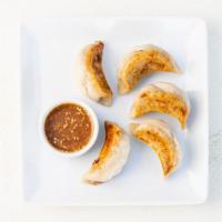 The Sweet Potato Potsticker · Pan-seared, gluten-free potstickers filled with roasted sweet potato, fresh garlic, and fres...