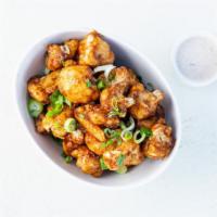 Sweet & Sour Cauliflower Wings · Crispy gluten-free cauliflower wings tossed in Sweet & Sour sauce and served with housemade ...
