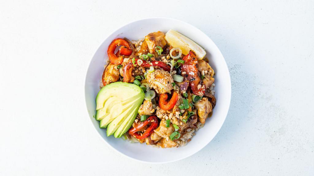 Kung Pao Avocado Bowl · Marinated chicken sautéed with Kung Pao sauce and served with avocado, charred peppers, caramelized onions, pickled fresno peppers, peanuts, green onions, and sesame seeds. Served with a lemon wedge and a base of your choice. (gluten-free)
