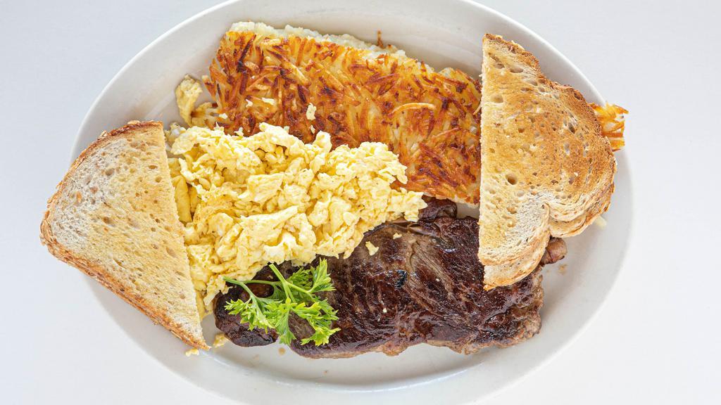 12. New York Steak (10 oz.) · Steak with two eggs, potatoes, buttered toast, and jelly.
