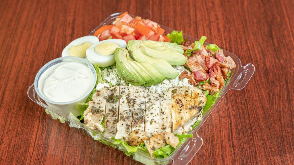 Cobb salad · Chicken breast, bacon, avocado, crumbled blue cheese and tomatoes on a fresh bed of lettuce With your choice of dressing.