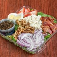 Spinach Salad · Spinach, crumbled bacon, walnuts, strawberries, onions, feta cheese, and a hard boiled egg t...