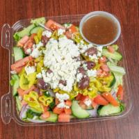 Greek Salad · Romaine lettuce, tomatoes, cucumbers, pepperoncini, green peppers, red onions, and feta chee...