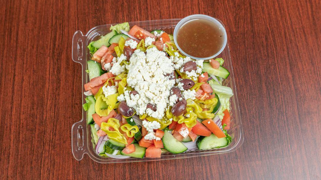 Greek Salad · Romaine lettuce, tomatoes, cucumbers, pepperoncini, green peppers, red onions, and feta cheese tossed in a Greek vinaigrette.