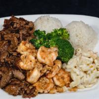 #11. Garlic Shrimp and BBQ Beef · Garlic Shrimp and Hawaiian BBQ Beef over cabbage and broccoli, includes 2 scoops of rice and...