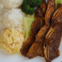 Kalbi Short Ribs · Grilled Marinated beef short ribs over cabbage and broccoli, includes 2 scoops of rice and 1...