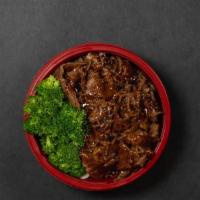 Teriyaki Beef Rice Bowl · BBQ Beef with homemade teriyaki sauce over cabbage, broccoli and white rice.