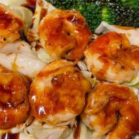 Teriyaki Shrimp Rice Bowl · Grilled Shrimps with homemade teriyaki sauce over cabbage, broccoli and white rice.