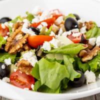 House Salad · Mixed Greens, goat cheese, cherry tomato, cranberry, walnut, kalamata olive and Italian or b...