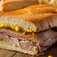 Cold Cuban Sandwich · Ham, pork loin, swiss cheese, yellow mustard, dill pickles on a baguette.