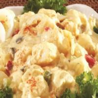 Deviled Egg Potato Salad · Our Classic potato salad tossed with hard-boiled eggs and sweet relish