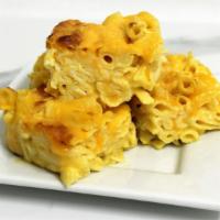 Macaroni and Cheese · Creamy elbow macaroni coated in a rich, velvety cheddar cheese sauce. Served cold in a micro...