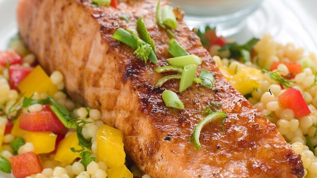 Salmon with Couscous · Baked salmon with couscous. Served cold in a microwavable container. Reheating required.
