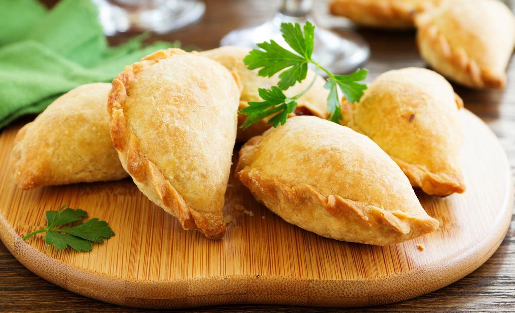 Chicken Cilantro Empanada · Empanada with chicken and cilantro. Served cold in a microwavable container. Reheating required.