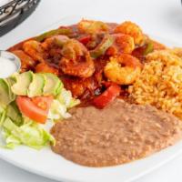 Camarones a la Diabla · Sautéed shrimp covered in a red sauce served with rice, beans, lettuce, tomato, sour cream &...