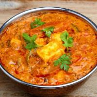 Shahi Paneer (SP) · Homemade cheese cubes sautéed with fresh ginger, garlic, onions and tomatoes in a cream sauc...