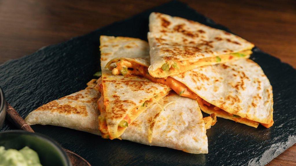 Breakfast  Quesadilla · Famous It’s a Grind Quesadillas filled with your choice of meat, eggs, shredded cheese and crispy hashbrowns