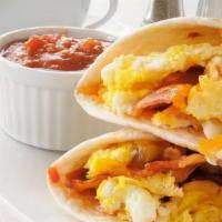 Morning Bacon Breakfast Burrito · Two scrambled eggs with crispy bacon, crispy fries, and melted cheese wrapped up in a 12