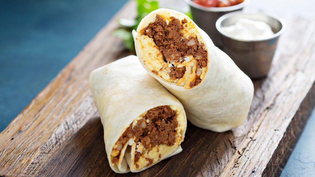 Spicy Chorizo Breakfast Burrito · Two scrambled eggs with spicy chorizo, crispy home fries, melted cheese, jalapenos, and sauteed onions and peppers wrapped up in a 12