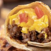 Delicious Deli Pastrami Breakfast Burrito · Two scrambled eggs with deli-style pastrami, crispy home fries, melted cheese, and carameliz...