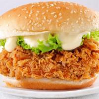 Crispy Chicken Burger · Sizzling chicken breast topped on with melted cheese, lettuce, tomatoes, pickles, onions, ke...