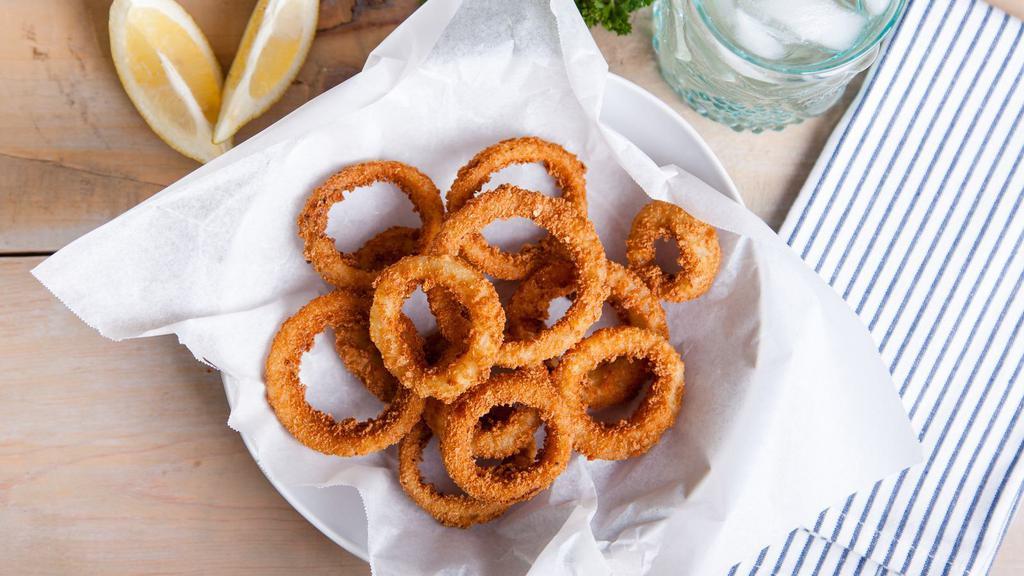 Onion Rings · Thick-cut onion rings are made from whole white  onions, battered with a subtle blend of spices.