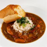 Chicken & Andouille Gumbo · Chicken, andouille sausage & okra gumbo with white rice & scallion. Cup or Bowl. (Bowl serve...