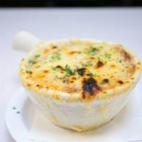 French Onion Soup · Topped with melted swiss cheese crouton. Contains beef broth.
