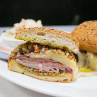 Muffuletta · A New Orleans classic: Ham, Salami, Mortadella, Swiss, Provolone & Mozzarella piled on a toa...