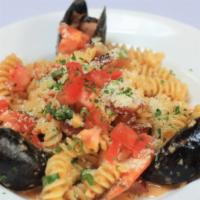 Pasta Orleans · Sautéed shrimp, crawfish, mussels, and andouille sausage with fusilli pasta in a spicy red p...