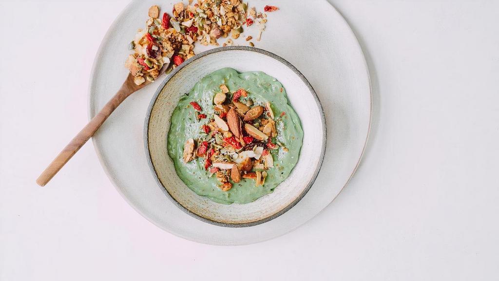 Spirulina Bowl · Green spirulina, Cacao nibs, Chia seeds, Dates, Avocado, Cashew-coconut drink. Topped with Granola & Goji Berries.