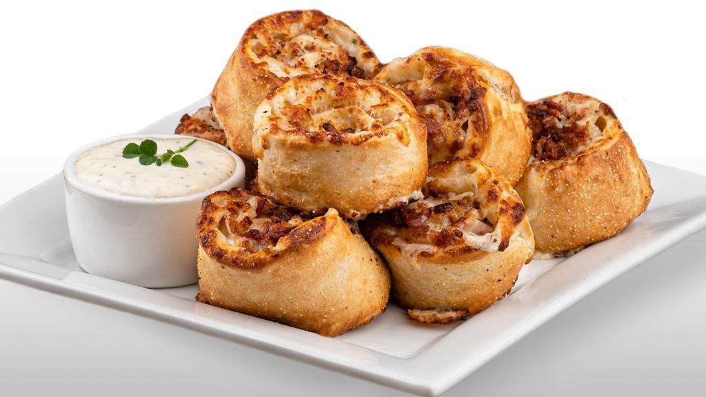 Cheezee Bacon Rolls · Rich and buttery bacon rolls made with our creamy signature white garlic sauce and filled with gooey mozzarella cheese and mouthwatering applewood smoked bacon.