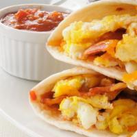The Bacon Breakfast Burrito · Slices of crispy bacon strips, seasoned potatoes, scrambled eggs, picante sauce, Crushed red...