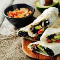 The Black Bean Breakfast Burrito · Cooked black beans, seasoned potatoes, scrambled eggs, picante sauce, Crushed red chillies w...