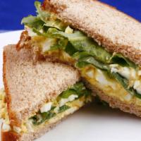 The Egg Sandwich · Fresh scrambled eggs mixed with cheese wrapped in customer's choice of bread.