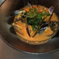 Sicilian Steamed Mussels · With spicy red wine marinara sauce