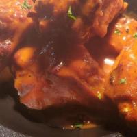 Jumbo Buffalo Wings · Homemade cajun-style hot sauce & your choice of dipping sauce