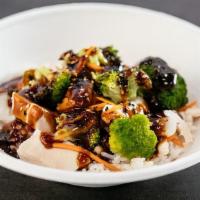 Eggplant Rice Bowl · Original hummus topped with charred eggplant, romaine cucumber tomato salad, tahini, and our...