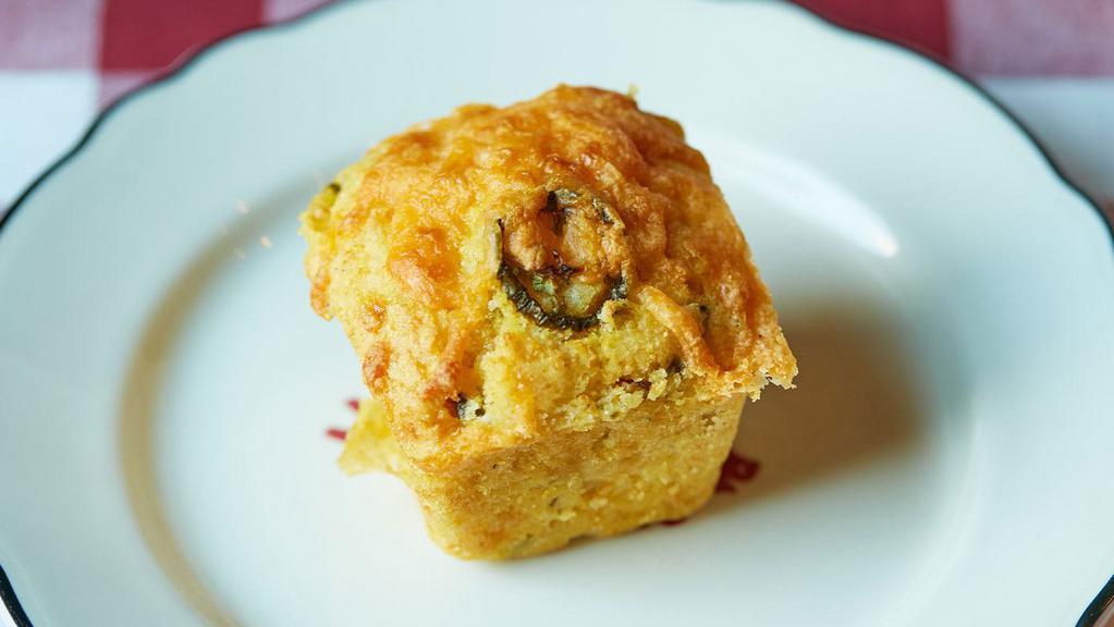 Smoked Jalapeño Cheddar Cornbread - Dozen · Sweet cornbread filled with diced jalapeños, cheddar cheese and corn niblets baked to a golden brown finish, then topped with more cheddar cheese and browned crispy on top. 12 pieces