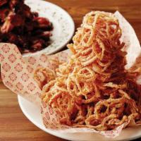 LUCILLE’S ONION STRAWS · A mountain of irresistible buttermilk battered fresh onions, seasoned and deep fried. Served...