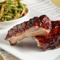 Baby Back Ribs · The tenderest, meatiest little pork ribs, slow-cooked with sweet hickory smoke, then grilled...
