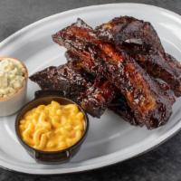 BBQ BEEF RIBS · Tender, big and meaty beef ribs, spice rubbed, slowly smoked, then glazed with our BBQ sauce.