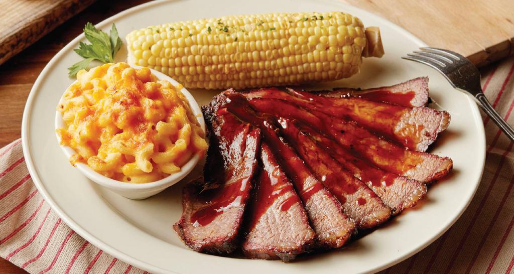 BBQ TRI TIP · Certified Angus Beef tri tip, smoked all day until it melts in your mouth. Hand-carved to order with our savory mop sauce.