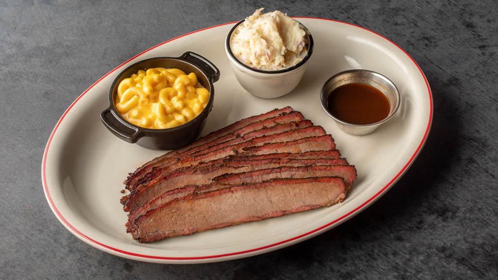 Texas Style Beef Brisket · Certified Angus Beef brisket slow-smoked and hand-carved to order. Served with our savory wet mop sauce..