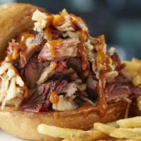 LUCILLE'S ORIGINAL PULLED PORK SANDWICH · Our special pork roast, slow-smoked until it's fork-tender, hand shredded and tossed in our ...