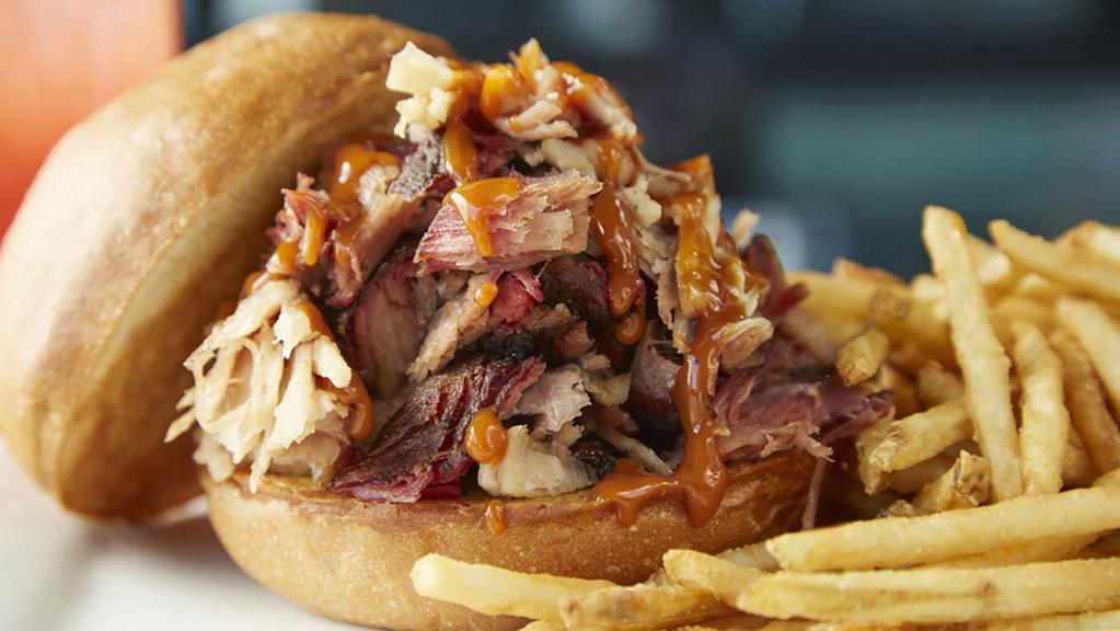 LUCILLE'S ORIGINAL PULLED PORK SANDWICH · Our special pork roast, slow-smoked until it's fork-tender, hand shredded and tossed in our special sauce on a potato bun.