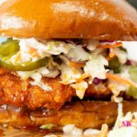 Nashville Hot Chicken Sandwich · Extra spicy, Nashville style, crispy fried chicken breast topped with sweet pickles and crea...